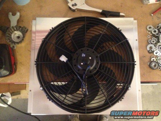 fan-riveted-to-shroud.jpg 65 Mustang-Champion 2 row radiator, shroud, and electric fan.