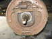 1948 Ford F1 - Close-up view of a rusty brake drum assembly, showing internal components like springs and brake shoes.
