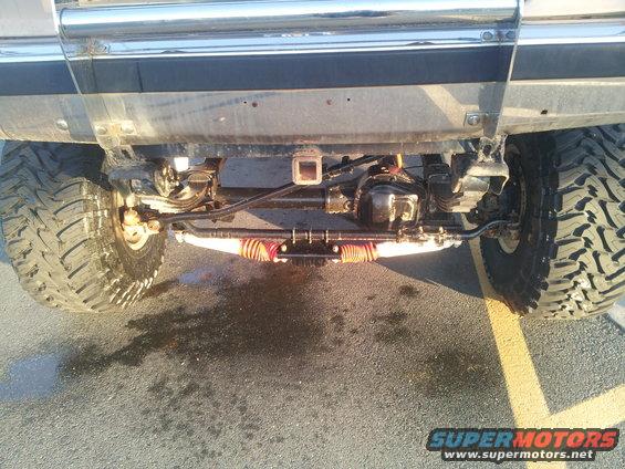 Rear axle, suspension components, and large off-road tires of a lifted truck