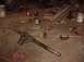1992 Ford Bronco - A vehicle axle and various tools are laid out on a concrete floor, suggesting a repair or modification project is underway.