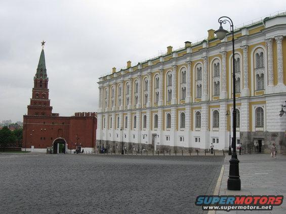 Kremlin buildings and paved square under overcast sky