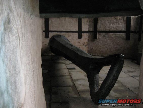 Black cannon barrel and carriage part inside stone structure