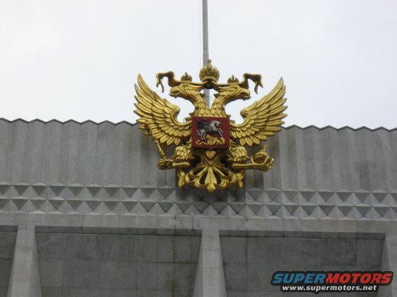 Golden double-headed eagle emblem on a building facade