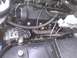 2003 Ford Crown Victoria - Engine bay components including the engine block, brake fluid reservoir, and ABS module are visible.
