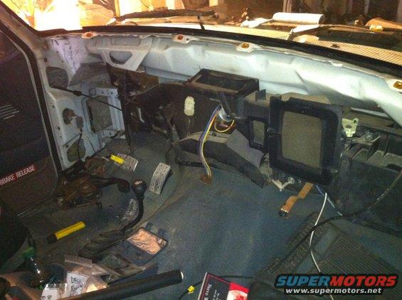 1992 Ford Bronco interior with dashboard removed, showing wiring and HVAC components