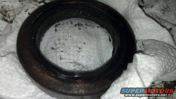 Close-up of a dirty automotive seal on a white cloth