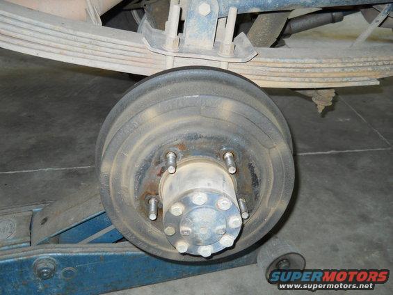 Rear drum brake assembly with leaf springs and jack