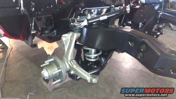 Front suspension assembly with shiny metal components and black frame parts
