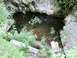 1992 Ford Explorer - A natural pool of water is seen within a rocky outcrop, surrounded by lush green foliage.