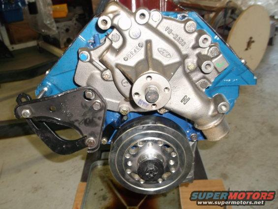 Ford V8 engine block with water pump and pulley assembly. Blue painted block