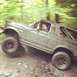 1995 Ford Bronco - This 1995 Ford Bronco navigates a muddy off-road course with a driver behind the wheel.