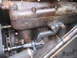 1912 Ford Model T - A close-up view of an engine component with visible rust and a "STANDARD MOTOR" label.