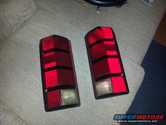 Pair of red taillights with black trim