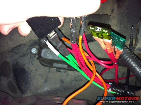 img_0548.jpg I decided my lights were too dim. I looked into the RJM harness, which looked like a GREAT product, but I couldn't afford it at the time. So I built my own. I had everything I needed except the headlight plugs which I got at Oreilly's for $10.

It uses the same coloring (almost) as the original harness, red for low beams, green for high beams, each of which have their own fuse. Ground is orange. It uses standard Ford relays so replacements will be plentiful.  It is all 12 gauge wire so current won't be too limited. There is a run of ~14 gauge that goes into each of the headlight connectors but they are only ~4 inches long.

No hacking of the factory wiring was done, so the harness can be removed like it was never even there.

The parts list includes:
Relays x2
12 gauge wire in 3 different colors
2 30 amp fuses
Heatshrink tubing
Solder
Varoius wire connectors
Zipties
1/2&quot; wire loom
2 headlight connectors

Here is how the circuit is wired:
[url=http://www.supermotors.net/registry/media/985236][img]http://www.supermotors.net/getfile/985236/thumbnail/relay_headlight_circuit_schematic.jpg[/img][/url]