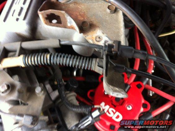 img_0689.jpg Unbolt the bracket shown above that hold the cable from the upper intake plenum and fold the cables and bracket out of the way.