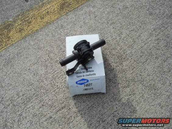 Murray 74627 heater valve on its box, sitting on concrete with yellow lines