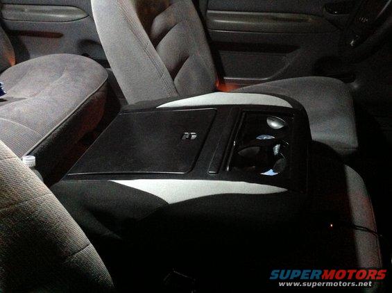 1997 Ford F-350 interior with gray cloth seats and a black center console with cup holders