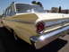 1963 Ford Fairlane - This yellow 1963 Ford Falcon sedan is shown from the rear quarter angle on a sunny day.
