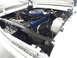 1963 Ford Fairlane - The engine bay of a 1963 Ford Fairlane, its blue engine and air cleaner assembly.