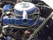 1963 Ford Fairlane - The engine bay features a blue painted engine block, a prominent air cleaner, and a blue battery.