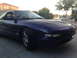 1996 Ford Probe - A purple 1996 Ford Probe is parked in a driveway.