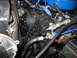 1979 Ford F-150 - Close-up view of an engine compartment, showing various engine parts and hoses.