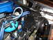 1979 Ford F-150 - Engine bay detail with spark plug wires and distributor cap visible.