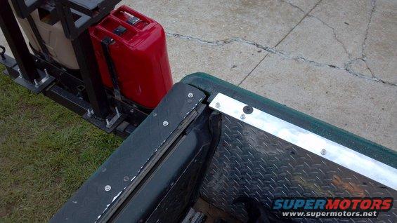 20130526_122113_547.jpg Driver's side rear corner.  Except for the spacing of the next to last screw (which varies from left to right), it's a mirror image of the passenger side.