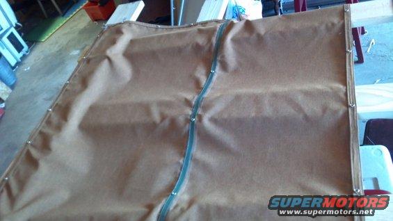 20130616_093702_905.jpg Underside of the cover.  The green webbing in the center runs all around the perimeter, wrapped in the fabric.  This was for strength and durability.