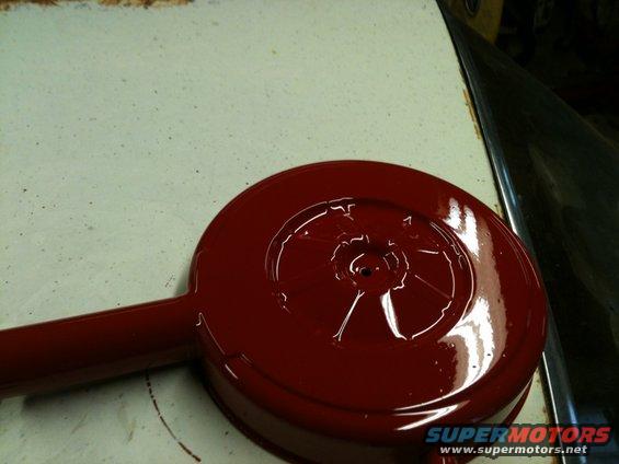 Red painted air cleaner assembly with a snorkel intake tube