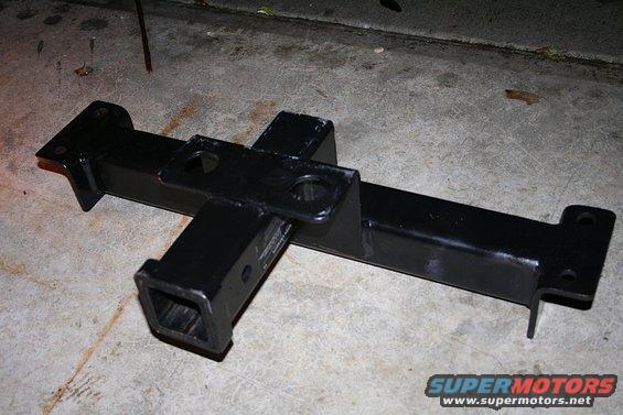 Black trailer hitch receiver on concrete floor