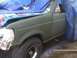1996 Ford Bronco - This Ford Bronco is partially covered by tarps and appears to be undergoing some form of restoration or modification.