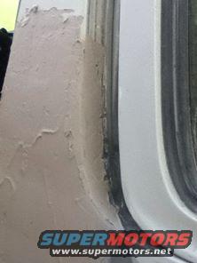 Body filler on vehicle door frame. Supermotors.net logo visible