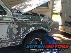 Front fender of a Ford Bronco undergoing bodywork, hood open
