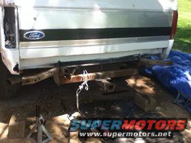 White Ford Bronco rear with tow hitch, SuperMotors logo visible