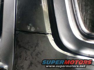 Close-up of a metal body panel with a visible seam and some repair marks. Supermotors.net logo in lower right