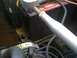 1964 Ford Ranchero - Close-up view of a car battery and some engine parts under the hood.