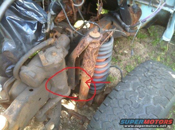 rusted suspension parts and tire from a vehicle