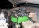 1979 Ford Bronco - The engine bay shows a green-painted engine block with aftermarket carburetor and air filter, suggesting a custom build.