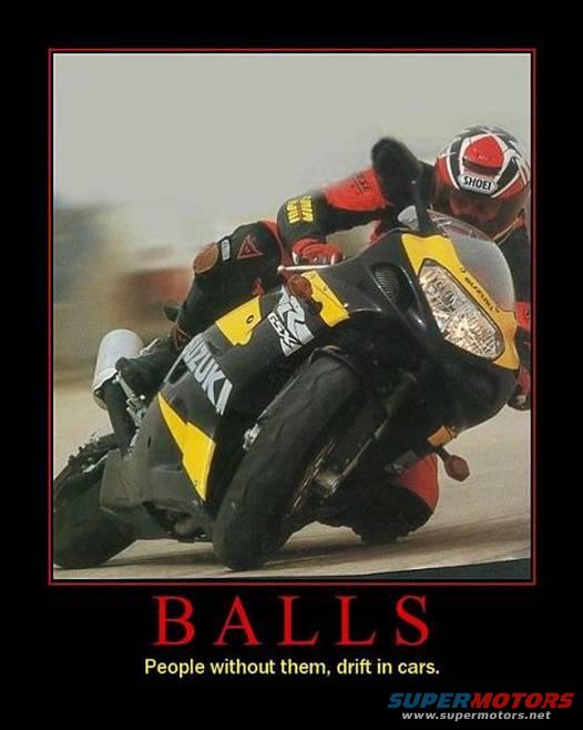 Motorcycle leaning into a turn, rider in full gear