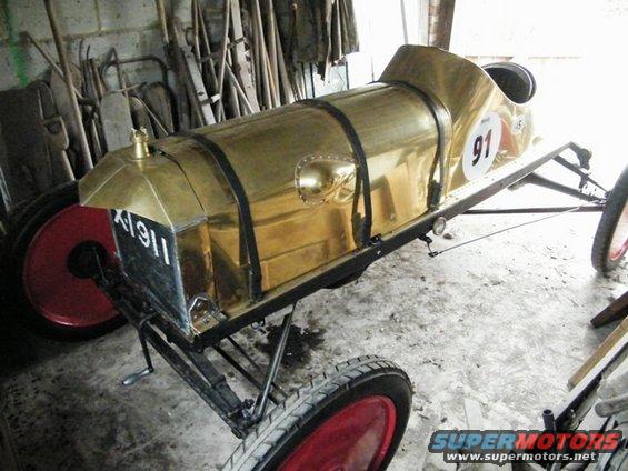 Brass speedster with red wheels and number 91 on side