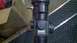 1993 Suzuki Sidekick - Close-up view of a Bushnell Trophy riflescope, showing its branding and adjustment mechanisms.