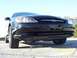 2003 Ford Taurus - A black Ford sedan is shown from a low front angle, with a date stamp indicating it was photographed in 2003.