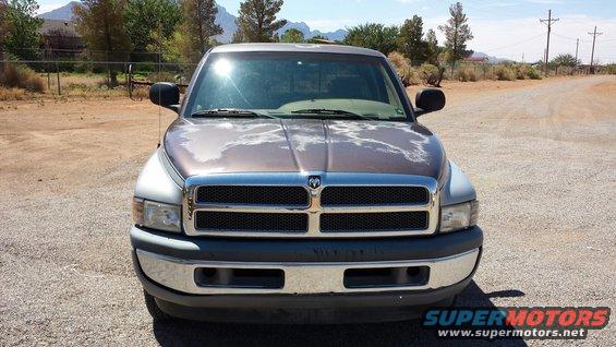 Front view of a 1994 Dodge Ram pickup truck with peeling paint on the hood