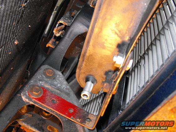 dscf2599.jpg I'm particularly pleased with the driver's side lower cooler bracket mount. I used one of the body bolts that hold the upright core support and some strap steel bent past 90 degrees (pic doesn't show that) from the Lincoln install (or even a car or two before that maybe). IIRC this was the first bracket mounted.