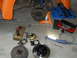 1992 Ford Bronco - Various car brake components and a set of wrenches are visible on the floor.