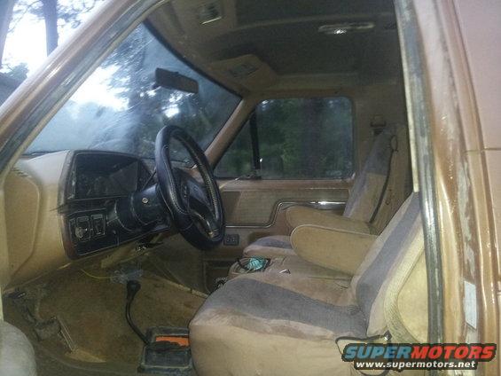 Interior of 1988 Ford Bronco, tan seats, dashboard, steering wheel