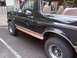 1994 Ford Bronco - This Ford Bronco has a two-tone paint scheme with a tan lower body trim.