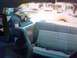 1994 Ford Bronco - View from inside a tan 1992 Ford Bronco, showing the rear seats and a spare tire.