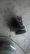 1983 Ford F-250 - A water pump pulley assembly is shown resting on a concrete surface.